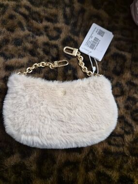 lululemon athletica Plush Faux Fur Nano  in Light Beige with Gold Chain